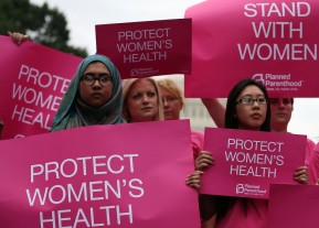 WASHINGTON, DC - JULY 11: Women hold up signs during a women's pro-choice rally on Capitol Hill, July 11, 2013 in Washington, DC. The rally was hosted by Planned Parenthood Federation of America to urge Congress against passing any legislation to limit access to safe and legal abortion.  (Photo by Mark Wilson/Getty Images)